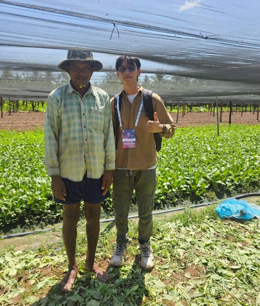 Chomkar team with a bok choy farmer, Kang Meas, Kampong Cham