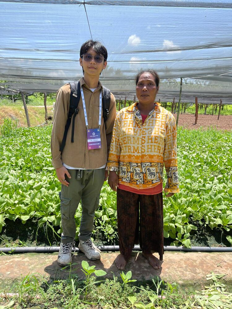 A woman bok choy farmer with the team, Kang Meas, Kampong Cham